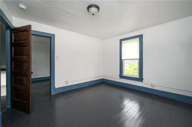 920 Roup Ave, Brackenridge, PA 15014 - empty room featuring dark wood finished floors, baseboards, and a smoke detector