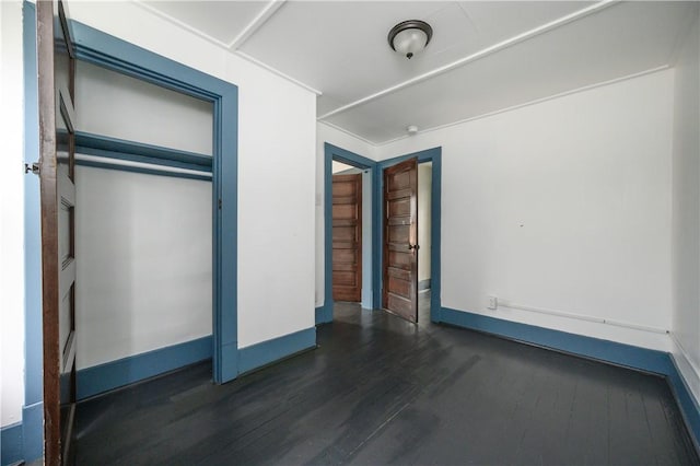 920 Roup Ave, Brackenridge, PA 15014 - unfurnished bedroom with wood finished floors, baseboards, and a closet