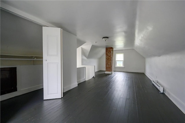 920 Roup Ave, Brackenridge, PA 15014 - additional living space featuring dark wood finished floors, baseboards, vaulted ceiling, and a baseboard heating unit