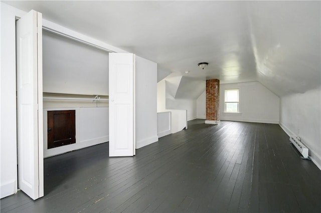 920 Roup Ave, Brackenridge, PA 15014 - additional living space with a baseboard radiator, dark wood-type flooring, vaulted ceiling, and baseboards