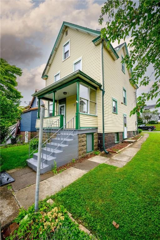 920 Roup Ave, Brackenridge, PA 15014 - back of property featuring a yard and a porch