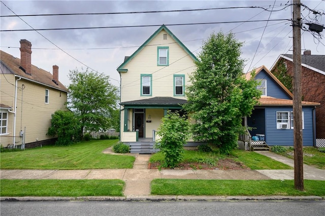 920 Roup Ave, Brackenridge, PA 15014 - view of front facade with covered porch and a front lawn