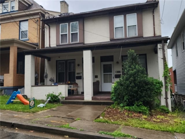 1509 Kelton Ave, Dormont, PA 15216 - view of front facade with brick siding, a porch, and a chimney