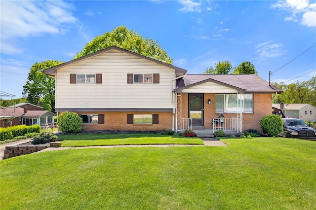 1317 Cathell Rd, Baldwin Boro, PA 15236 - tri-level home featuring covered porch, brick siding, and a front lawn