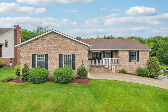 108 Covington Dr, Center Twp, PA 16001 - ranch-style house with brick siding, a front yard, and covered porch