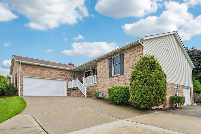 108 Covington Dr, Center Twp, PA 16001 - ranch-style home with brick siding, concrete driveway, and an attached garage