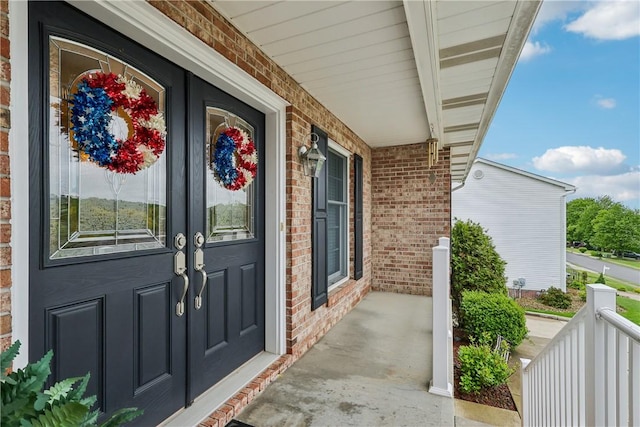 108 Covington Dr, Center Twp, PA 16001 - view of exterior entry featuring covered porch and brick siding