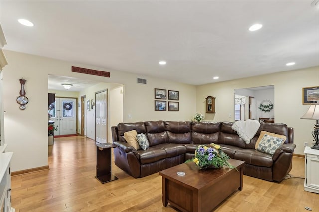 108 Covington Dr, Center Twp, PA 16001 - living room with light wood finished floors, arched walkways, and recessed lighting