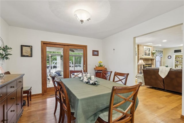 108 Covington Dr, Center Twp, PA 16001 - dining area featuring light wood-style floors, a brick fireplace, recessed lighting, french doors, and baseboards