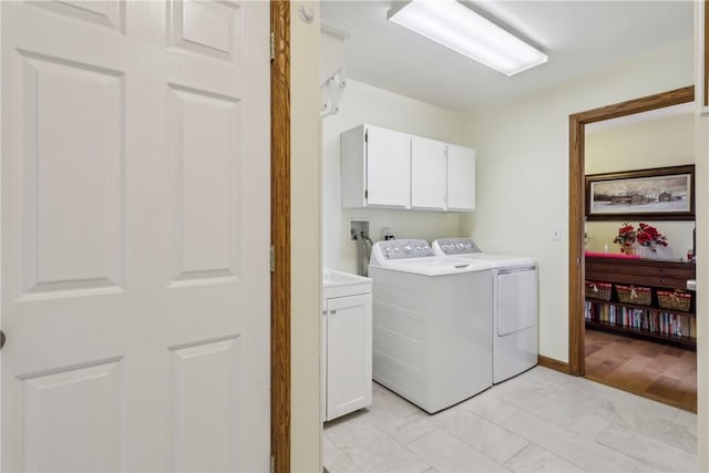 108 Covington Dr, Center Twp, PA 16001 - laundry area featuring cabinet space, washing machine and clothes dryer, and light marble finish floors