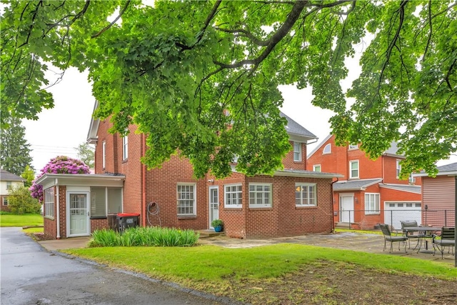 111 E Sheridan Ave, New Castle/2Nd, PA 16105 - view of front facade featuring brick siding and a patio area