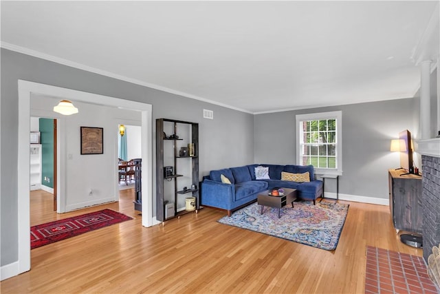 111 E Sheridan Ave, New Castle/2Nd, PA 16105 - living area with wood finished floors, baseboards, a brick fireplace, and crown molding