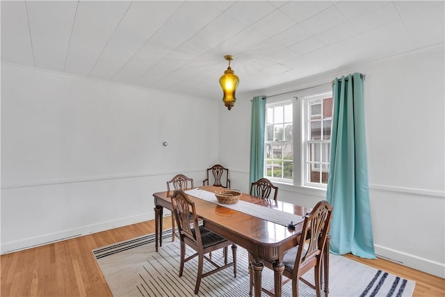 111 E Sheridan Ave, New Castle/2Nd, PA 16105 - dining room featuring baseboards, wood finished floors, and ornamental molding
