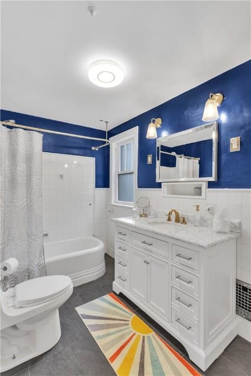 111 E Sheridan Ave, New Castle/2Nd, PA 16105 - bathroom with shower / tub combo, vanity, tile patterned flooring, tile walls, and a wainscoted wall
