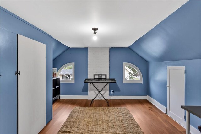 111 E Sheridan Ave, New Castle/2Nd, PA 16105 - additional living space with lofted ceiling, wood finished floors, and baseboards