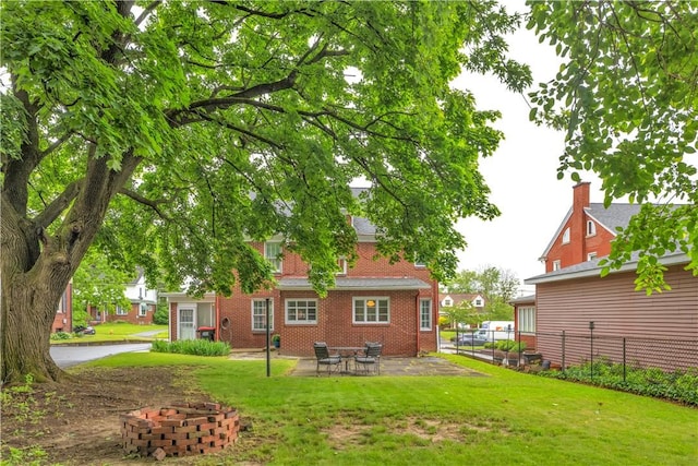 111 E Sheridan Ave, New Castle/2Nd, PA 16105 - rear view of house with brick siding and a patio
