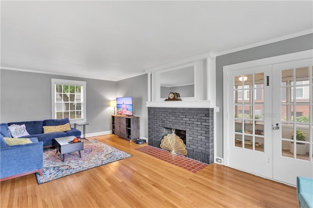 111 E Sheridan Ave, New Castle/2Nd, PA 16105 - living area with crown molding, wood finished floors, baseboards, a fireplace, and french doors