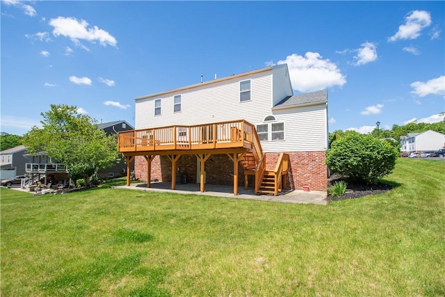 821 Kingston Dr, South Fayette, PA 15057 - back of property featuring a wooden deck, stairway, brick siding, a lawn, and a patio area
