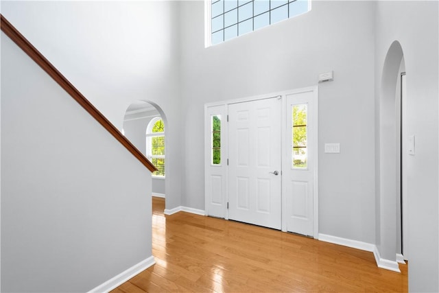821 Kingston Dr, South Fayette, PA 15057 - foyer with arched walkways, a towering ceiling, and plenty of natural light