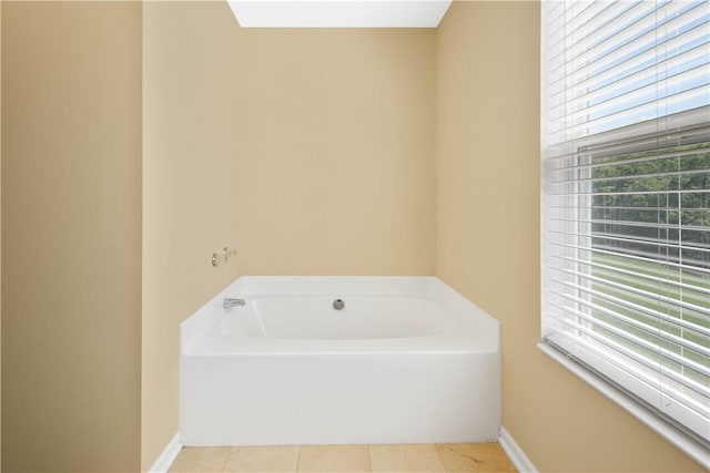 821 Kingston Dr, South Fayette, PA 15057 - full bath with a garden tub, plenty of natural light, tile patterned flooring, and baseboards