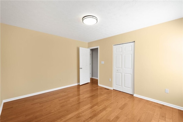 821 Kingston Dr, South Fayette, PA 15057 - unfurnished bedroom featuring light wood-style floors, baseboards, and a closet