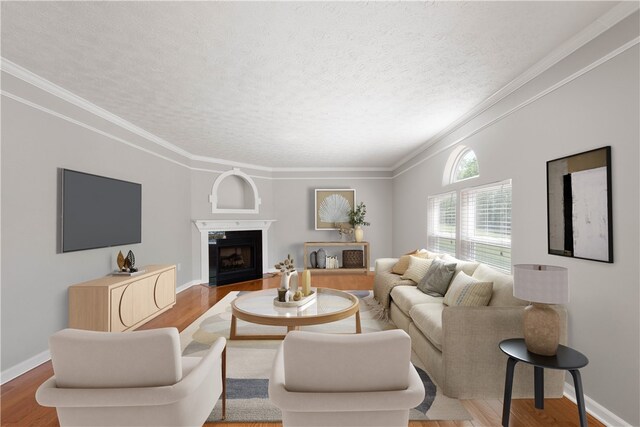 821 Kingston Dr, South Fayette, PA 15057 - living room featuring wood finished floors, a textured ceiling, crown molding, a fireplace with flush hearth, and baseboards