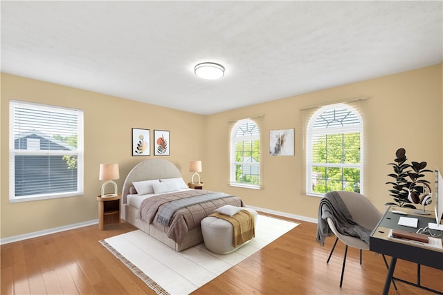 821 Kingston Dr, South Fayette, PA 15057 - bedroom featuring wood-type flooring, baseboards, and multiple windows