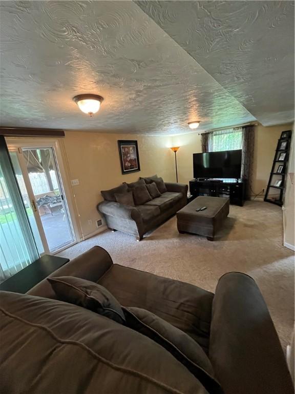 417 Longview Dr, Monroeville, PA 15146 - living room with carpet, a textured ceiling, and baseboards