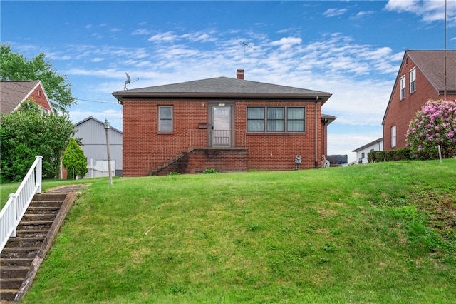 1007 High St, Luzerne Twp, PA 15417 - back of property featuring a lawn, a chimney, and brick siding
