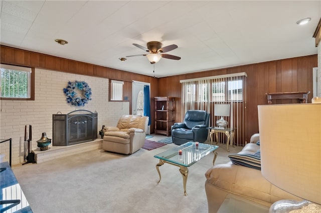 1007 High St, Luzerne Twp, PA 15417 - carpeted living room with a brick fireplace, ceiling fan, and wood walls