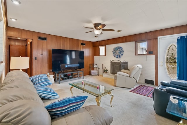1007 High St, Luzerne Twp, PA 15417 - carpeted living room featuring a ceiling fan and wooden walls