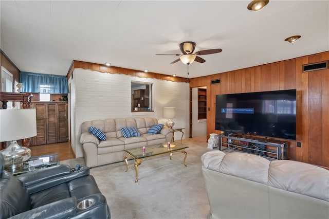 1007 High St, Luzerne Twp, PA 15417 - carpeted living room featuring a ceiling fan and wood walls