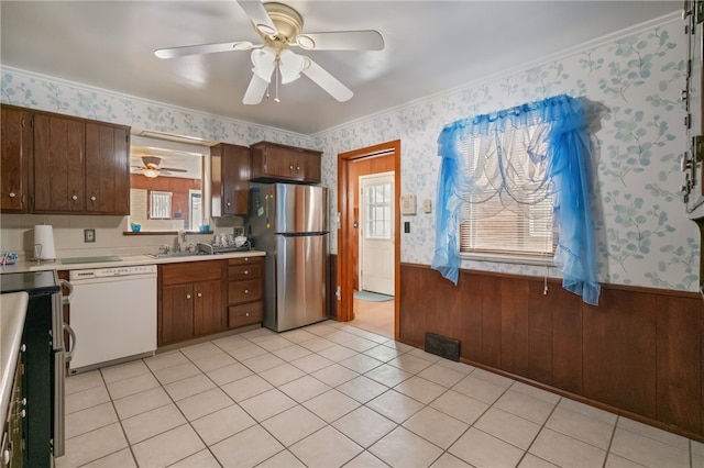 1007 High St, Luzerne Twp, PA 15417 - kitchen featuring freestanding refrigerator, white dishwasher, wallpapered walls, light countertops, and a ceiling fan