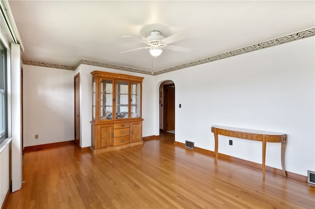 1007 High St, Luzerne Twp, PA 15417 - spare room with arched walkways, ceiling fan, light wood-style floors, and baseboards