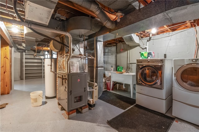 1007 High St, Luzerne Twp, PA 15417 - unfinished basement featuring gas water heater, washer and dryer, heating unit, and stairs