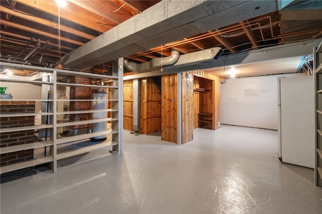 1007 High St, Luzerne Twp, PA 15417 - unfinished below grade area with freestanding refrigerator and secured water heater