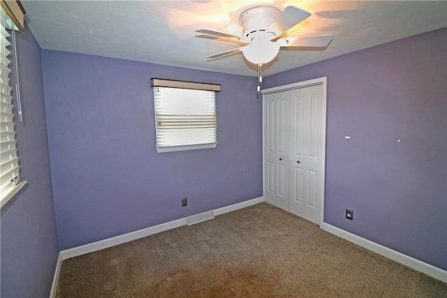 418 Newport Dr, Hempfield Twp Wml, PA 15601 - unfurnished bedroom featuring carpet, a closet, baseboards, and a ceiling fan