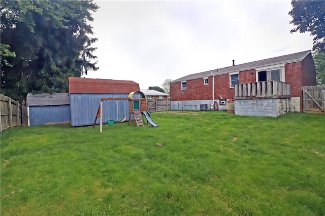 418 Newport Dr, Hempfield Twp Wml, PA 15601 - view of yard with central AC and a playground