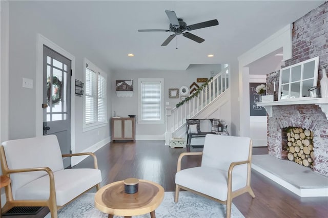 27 Laurel Ave, City Of Washington, PA 15301 - living area with wood finished floors, stairs, baseboards, a fireplace, and ceiling fan