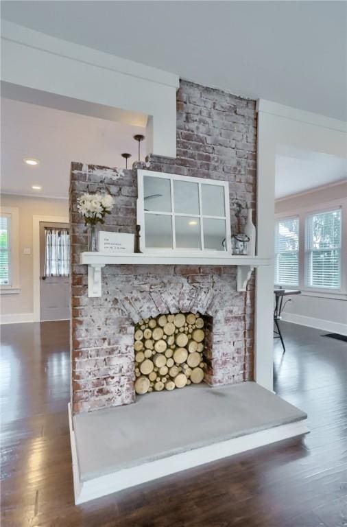 27 Laurel Ave, City Of Washington, PA 15301 - detailed view of baseboards, wood finished floors, and a large fireplace