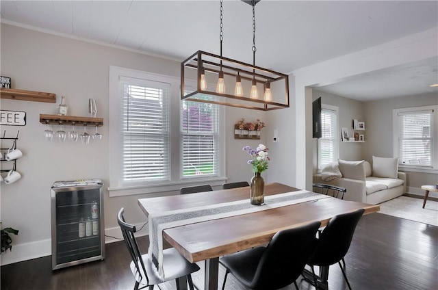 27 Laurel Ave, City Of Washington, PA 15301 - dining space featuring beverage cooler, wood finished floors, baseboards, and crown molding