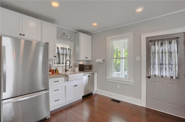 27 Laurel Ave, City Of Washington, PA 15301 - kitchen with appliances with stainless steel finishes, a sink, light countertops, dark wood-type flooring, and white cabinetry