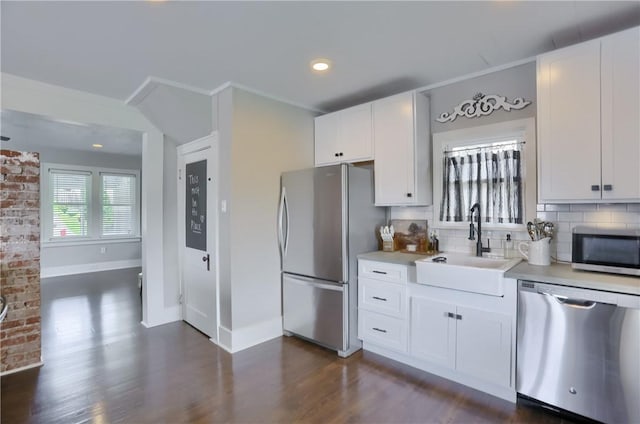 27 Laurel Ave, City Of Washington, PA 15301 - kitchen featuring stainless steel appliances, a sink, baseboards, light countertops, and dark wood-style flooring