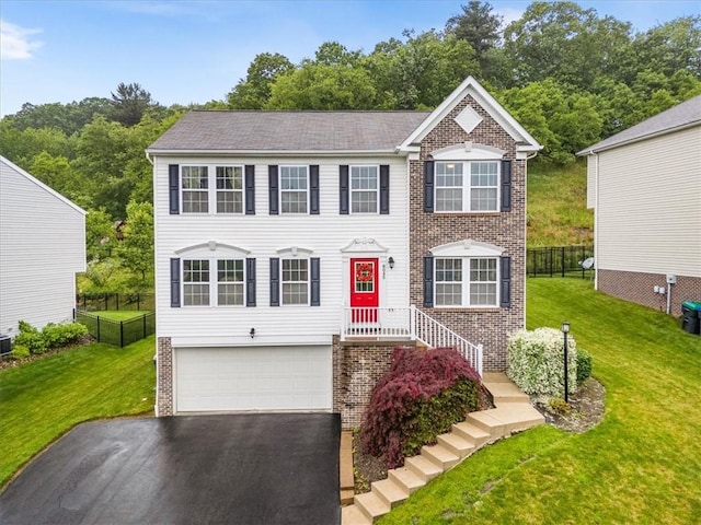 8045 Maureen Dr, Cranberry Twp, PA 16066 - view of front of house with a garage, driveway, and brick siding