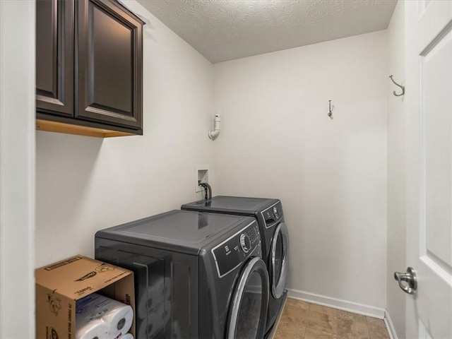 8045 Maureen Dr, Cranberry Twp, PA 16066 - laundry room with washer and clothes dryer, cabinet space, baseboards, and a textured ceiling