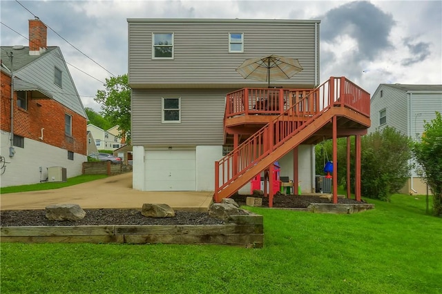 2114 Swallow Hill Rd, Scott Twp Sal, PA 15220 - back of house with stairs, an attached garage, driveway, a deck, and a lawn