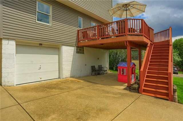 2114 Swallow Hill Rd, Scott Twp Sal, PA 15220 - view of side of property featuring an attached garage, driveway, stairs, a wooden deck, and a patio
