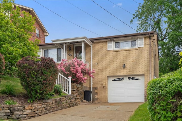 418 Lawnwood Ave, Brentwood, PA 15227 - view of front of home featuring an attached garage, brick siding, and driveway