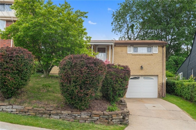 418 Lawnwood Ave, Brentwood, PA 15227 - view of front of house with concrete driveway, brick siding, and an attached garage