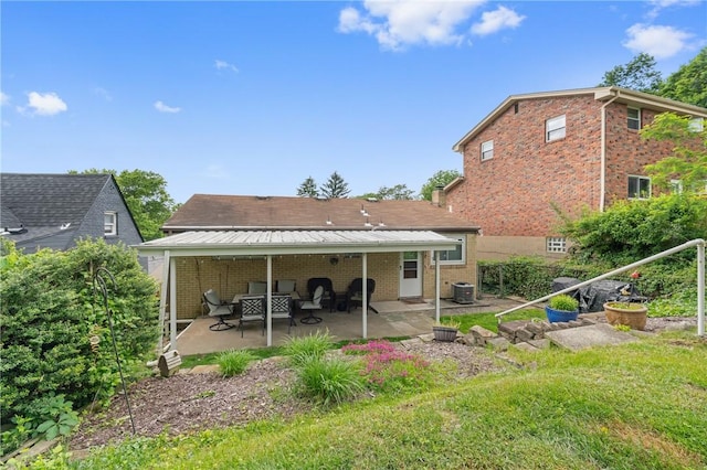 418 Lawnwood Ave, Brentwood, PA 15227 - rear view of property with a patio area, brick siding, central air condition unit, and an outdoor hangout area
